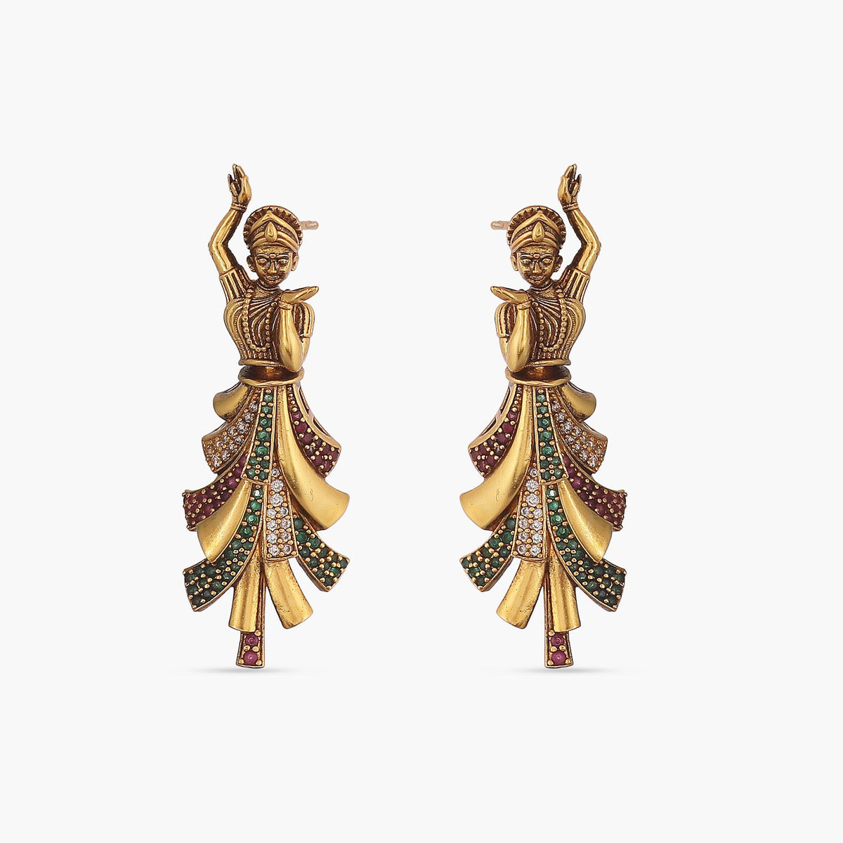 A picture of a pair of Indian artificial earrings in an antique gold tone with a dancing lady design on a white background, featuring green, red and Cubic Zirconia stones.